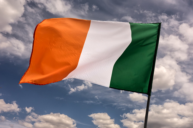Irish Flag Against Blue Sky