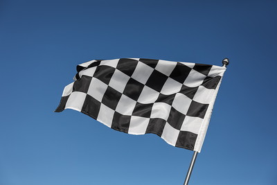 Chequered Flag Against Blue Sky