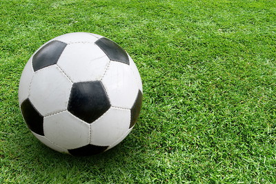 Close Up of Black and White Football on Pitch