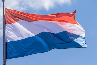 Dutch Flag Against Blue Sky